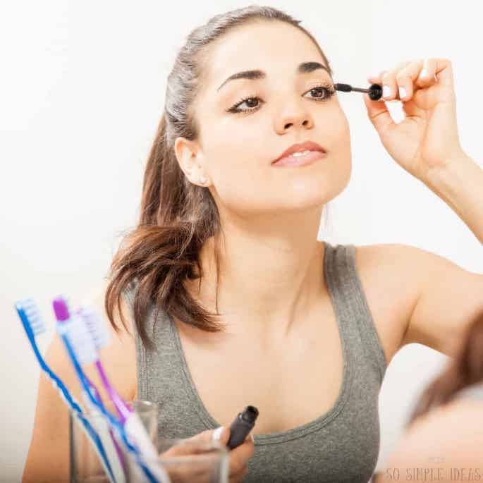 applying mascara.