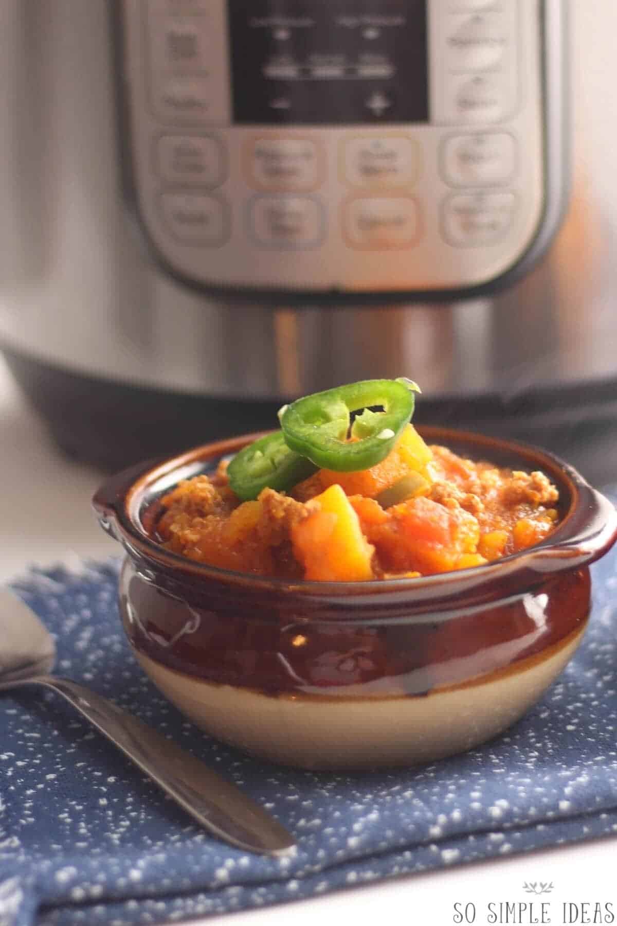 ground turkey chili in bowl with instant pot