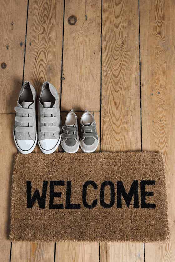 welcome mat with shoes in house