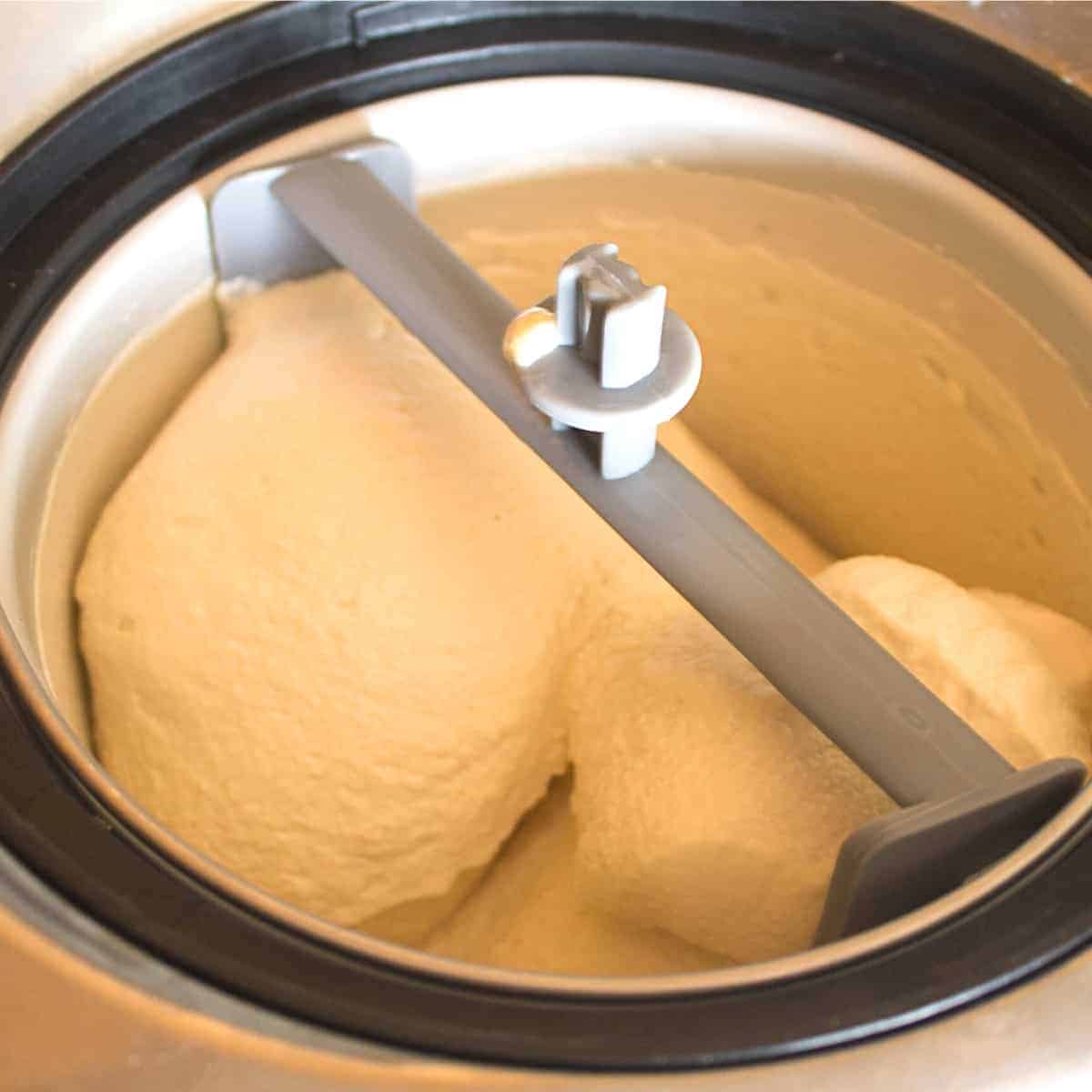 churning the peach ice cream without eggs