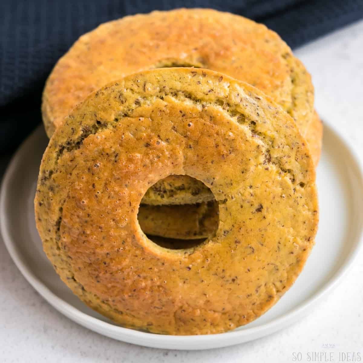 coconut flour keto onion bagels on white plate