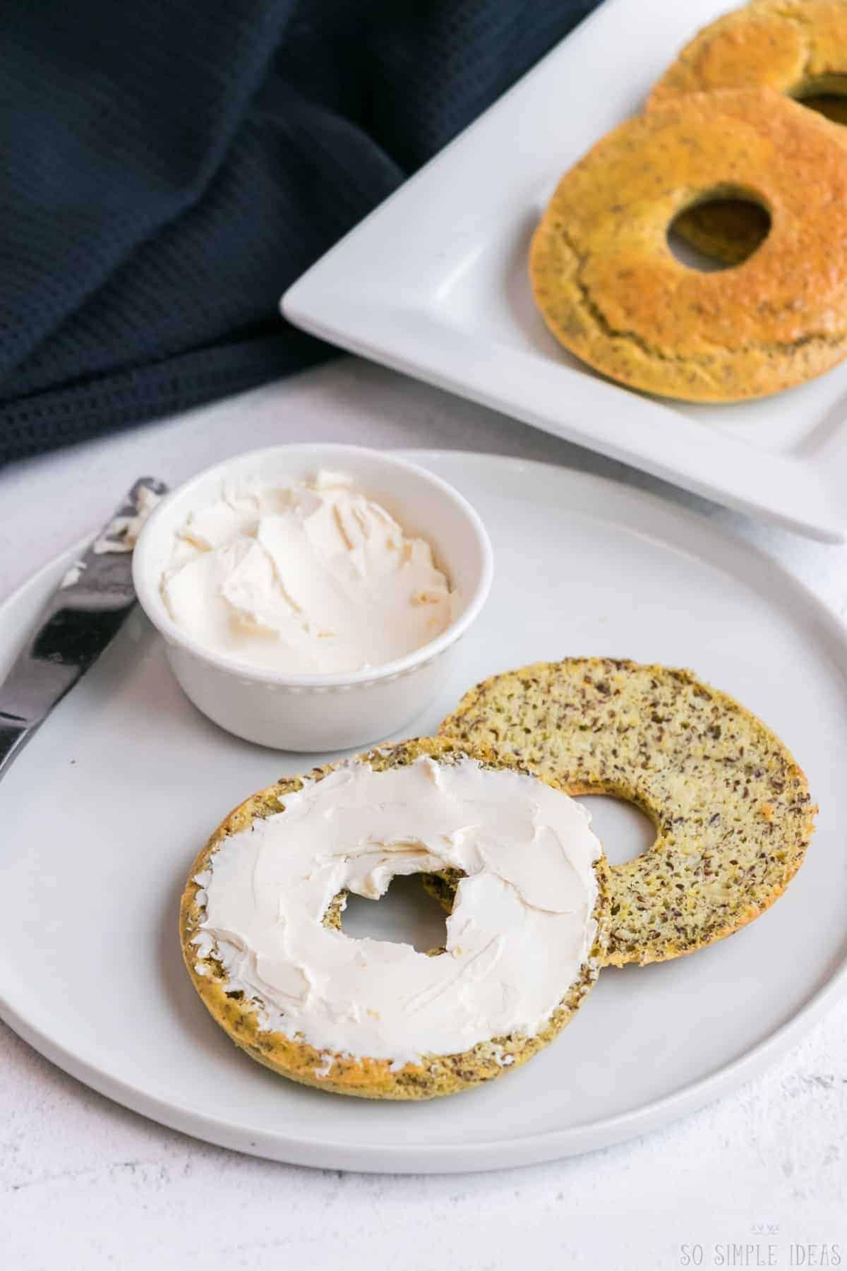 serving the keto coconut flour onion bagels with cream cheese