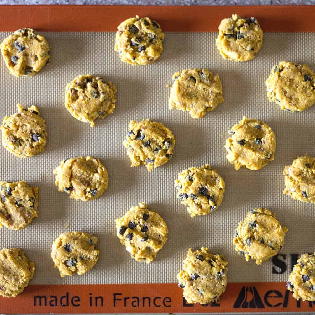 unbaked cookies on lined baking sheet