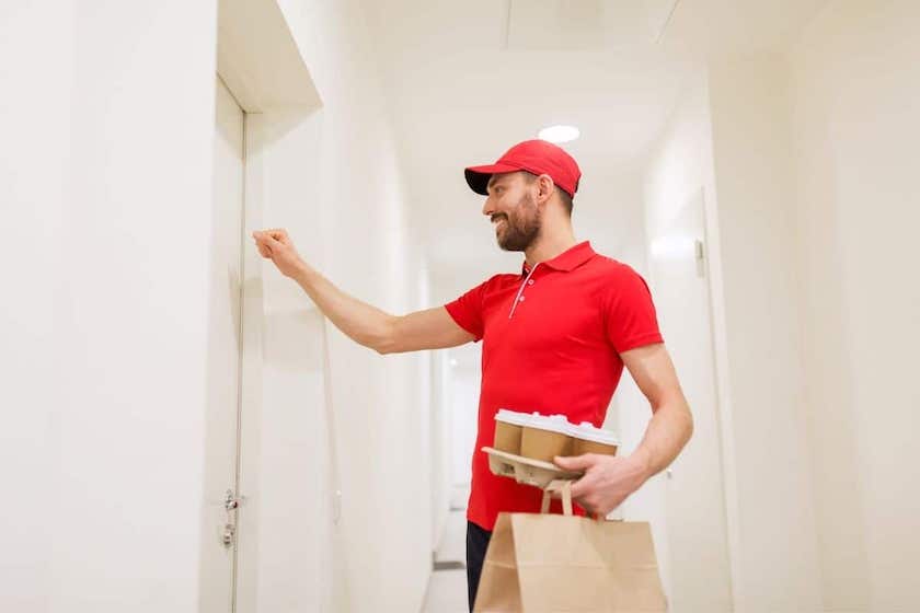 food delivery man knocking on door.