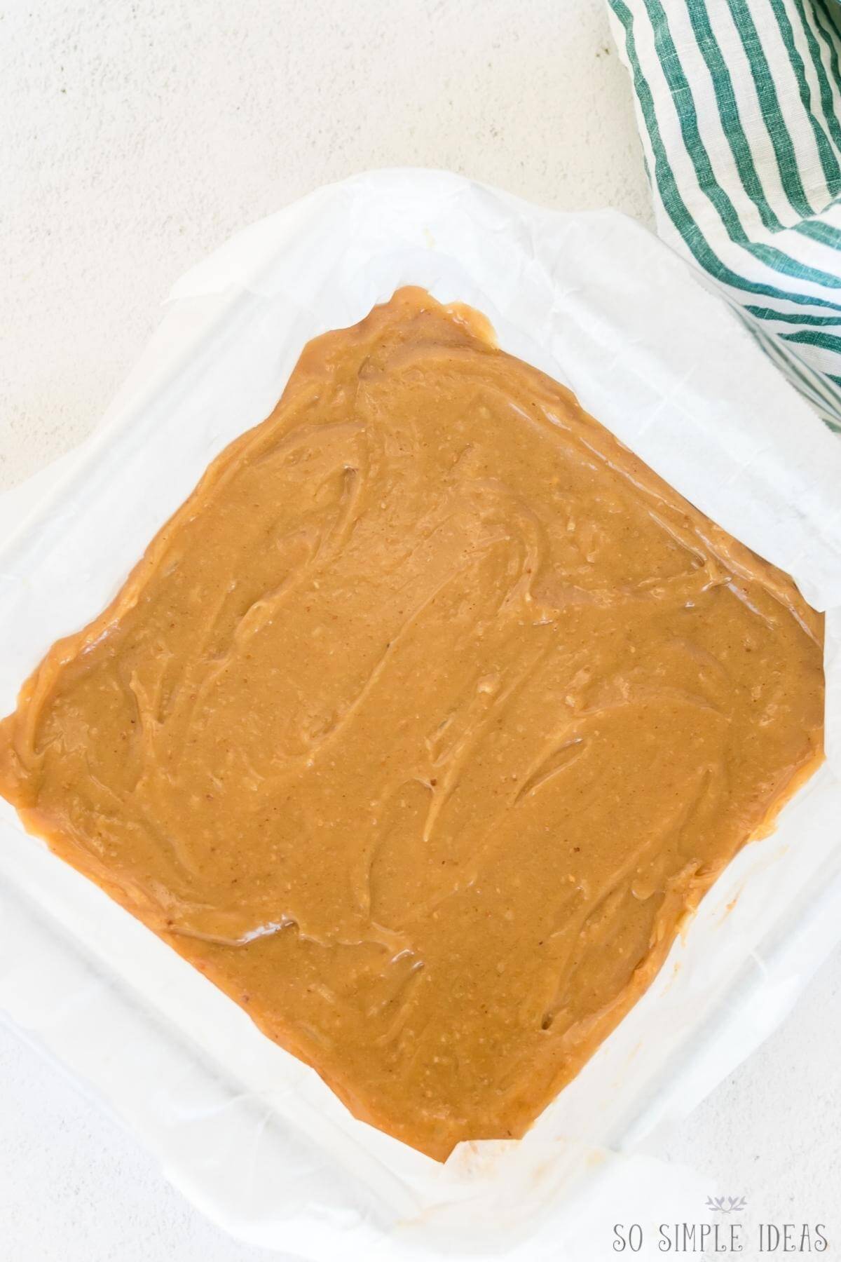 peanut butter mixture in lined square pan