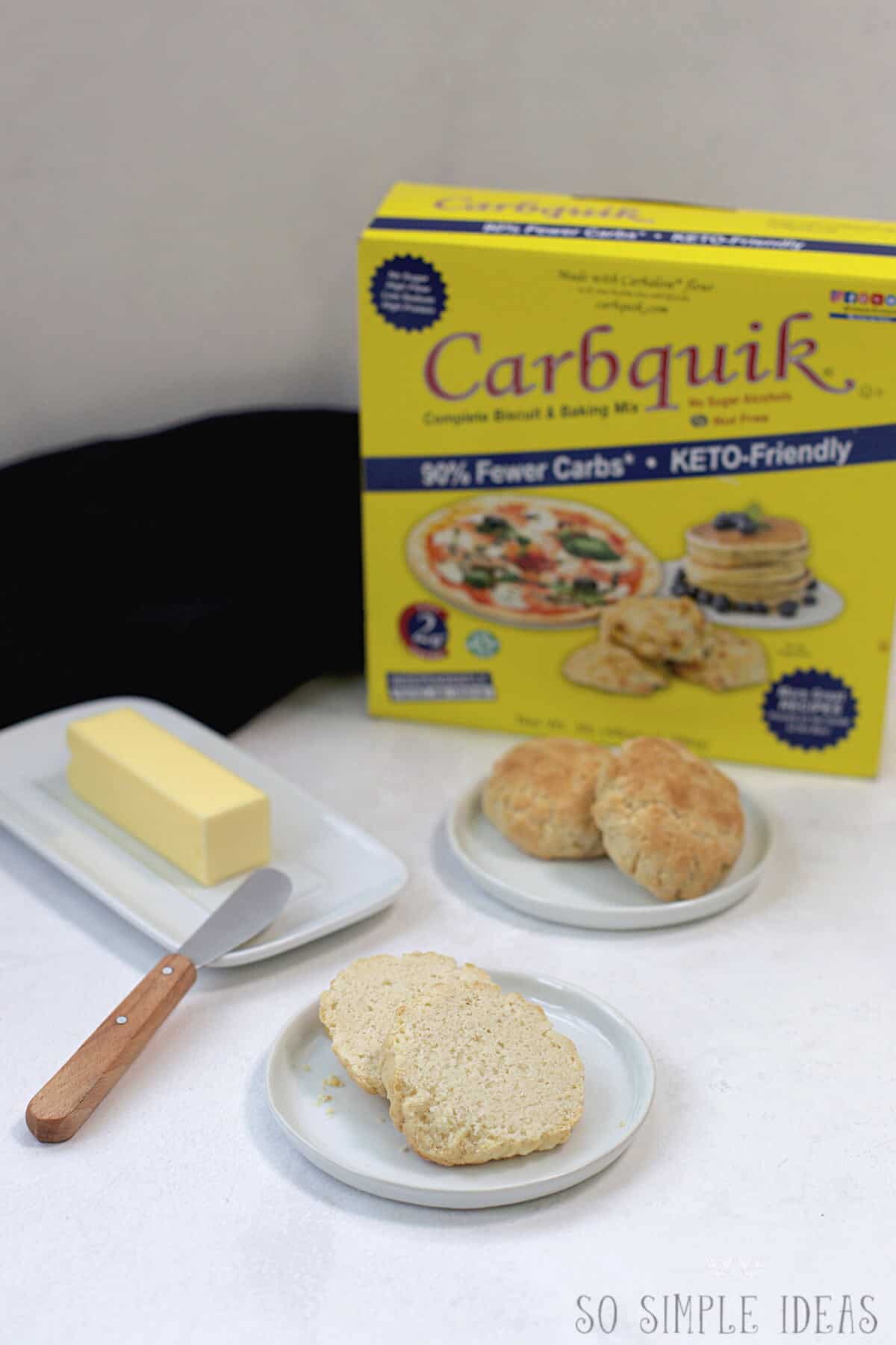 sliced biscuit with butter and carbquik box