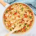 keto shrimp fried rice in pan with wooden spoon.