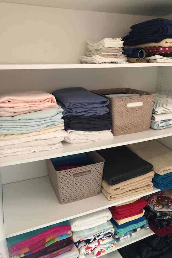 linen storage on a shelf.