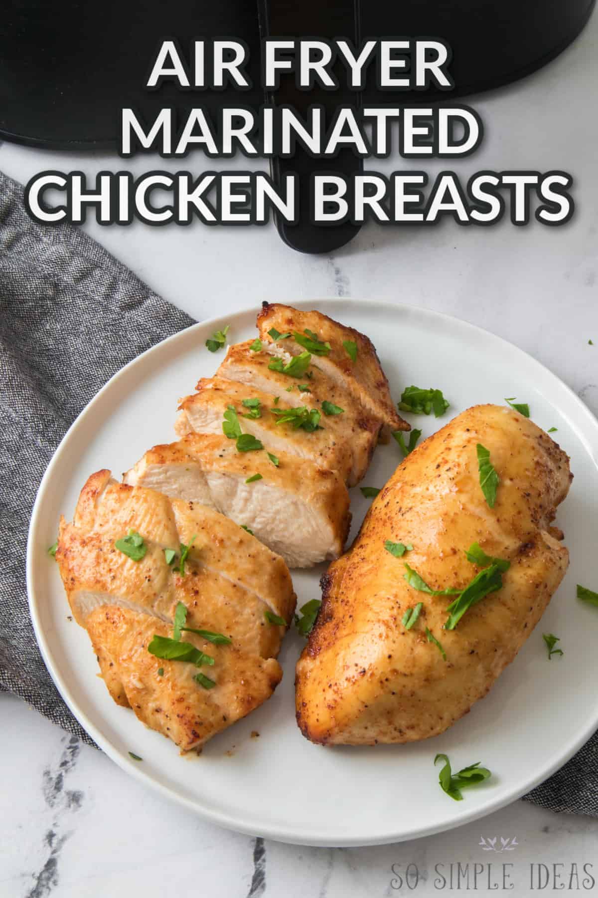 marinated chicken in air fryer with text overlay.