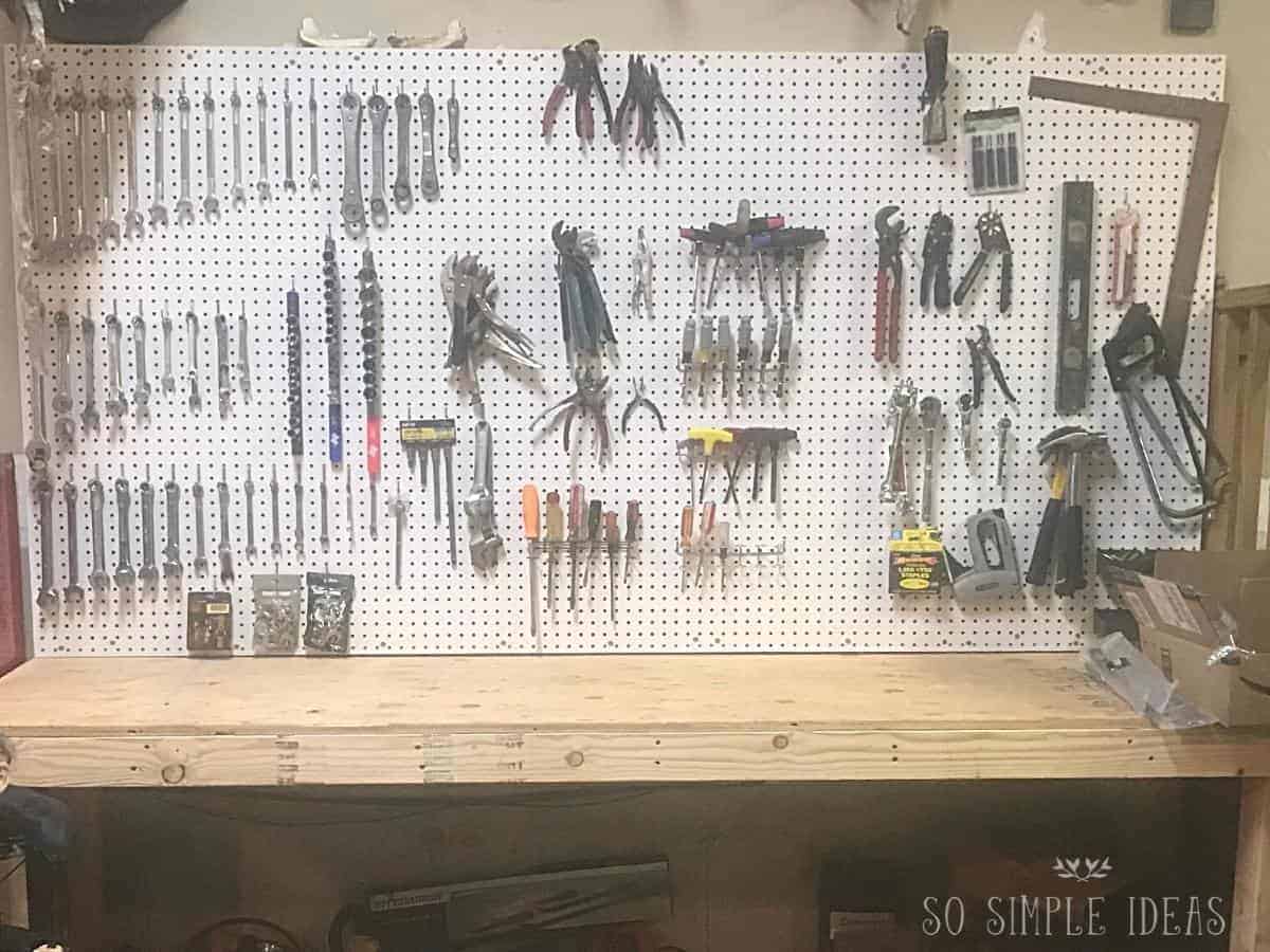 tools organized on peg board in garage.