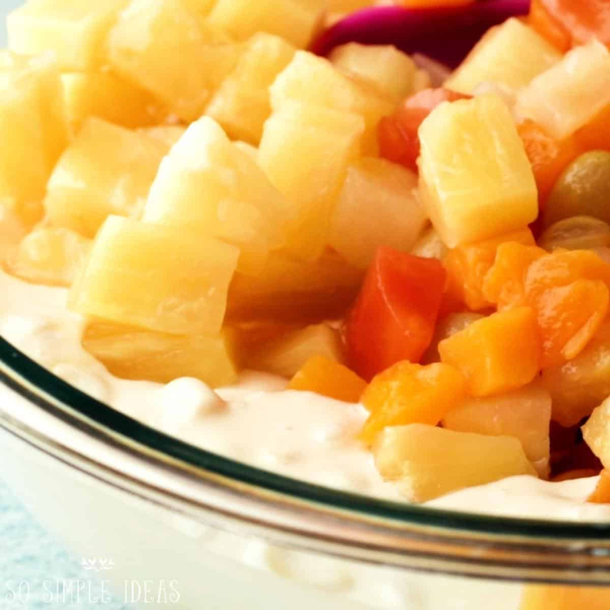 adding canned pineapple and tropical fruit.