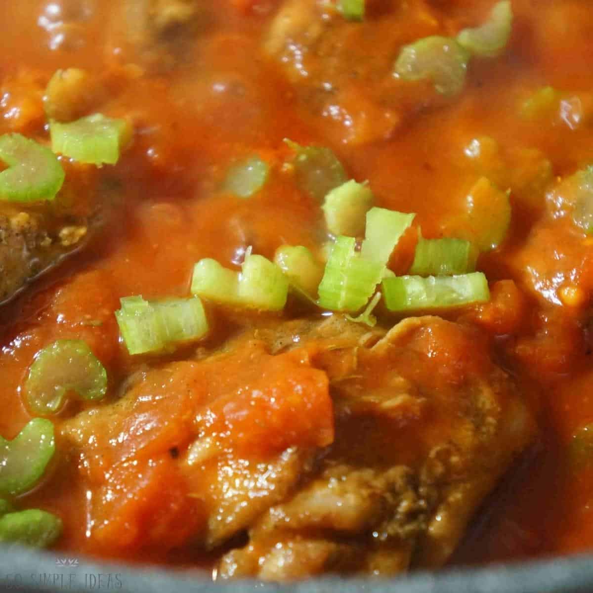 adding pan seared boneless chicken thighs and celery.