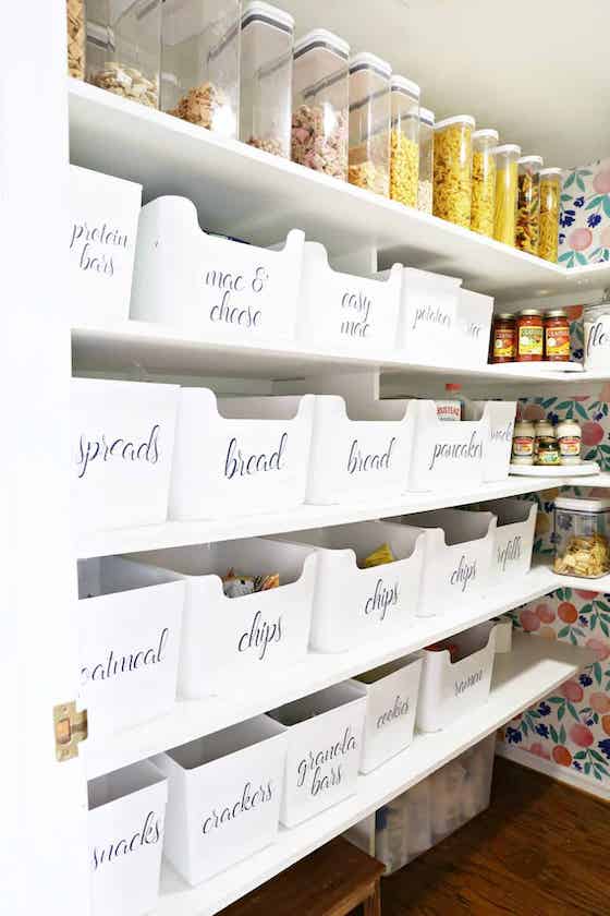 pantry makeover with white bins labeled.