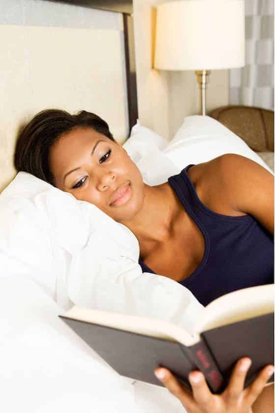 woman reading in bed.