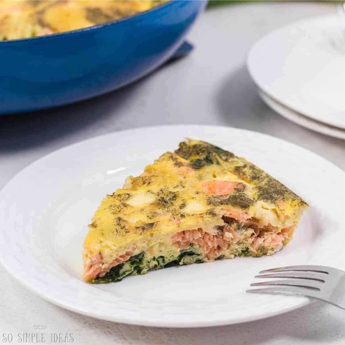 slice of salmon frittata on white plate.