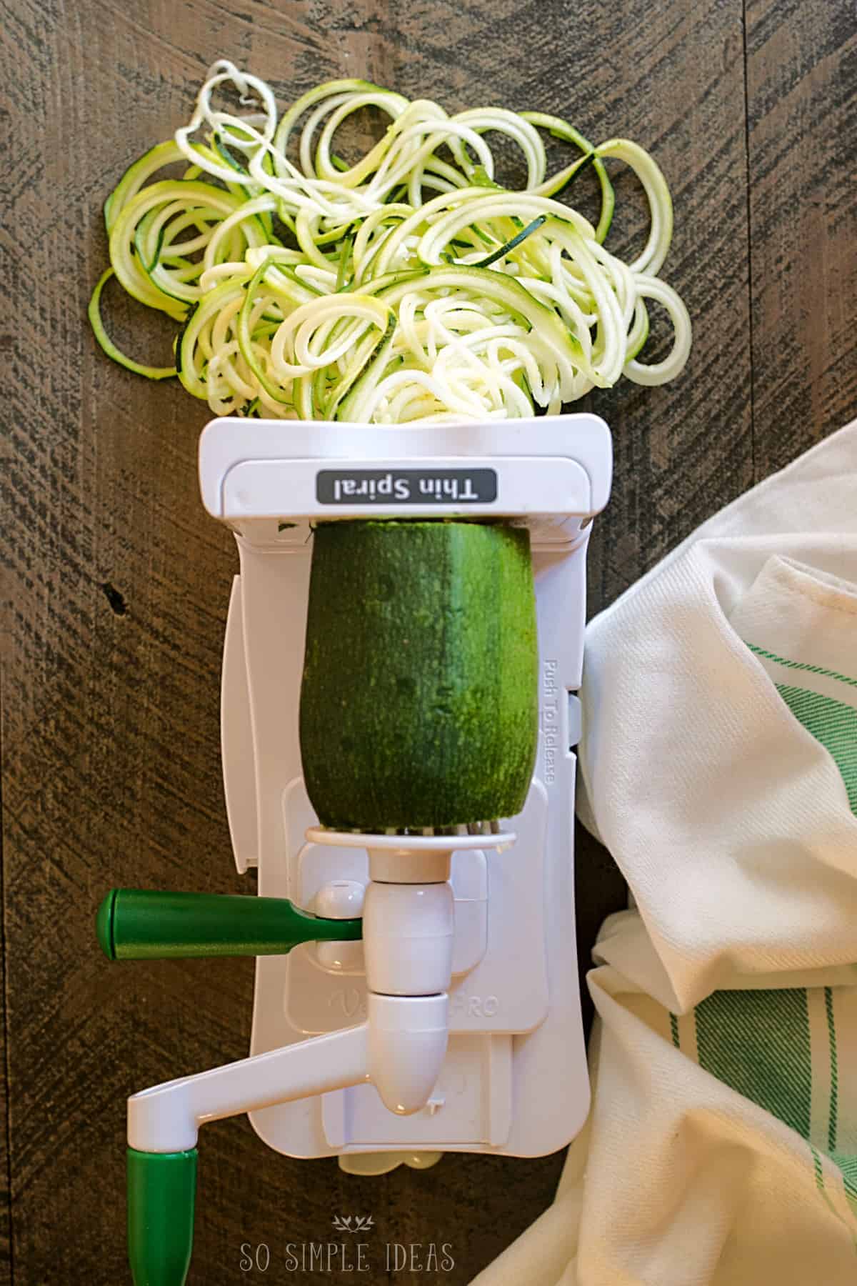 spiralizing zucchini for keto pasta.