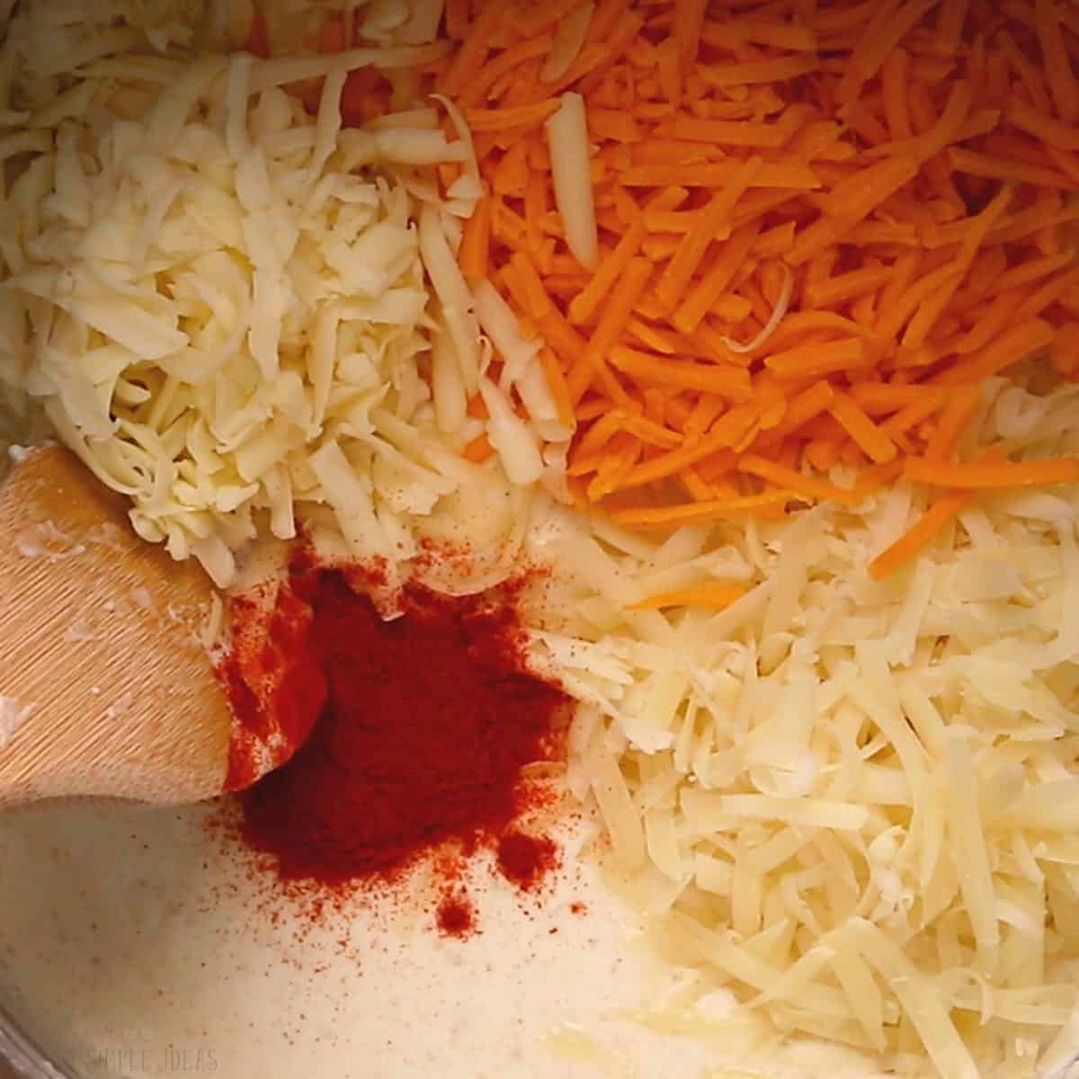 adding the cheese and spices to flour butter mixture.