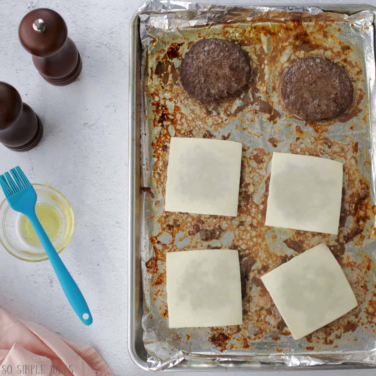 baked burgers with cheese added.