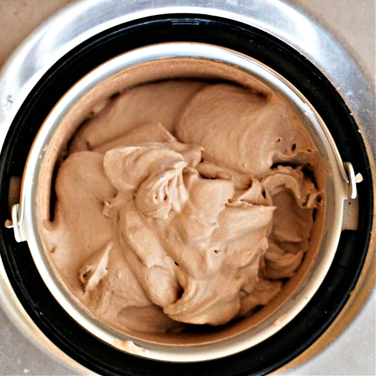 churned chocolate cheesecake ice cream in machine.