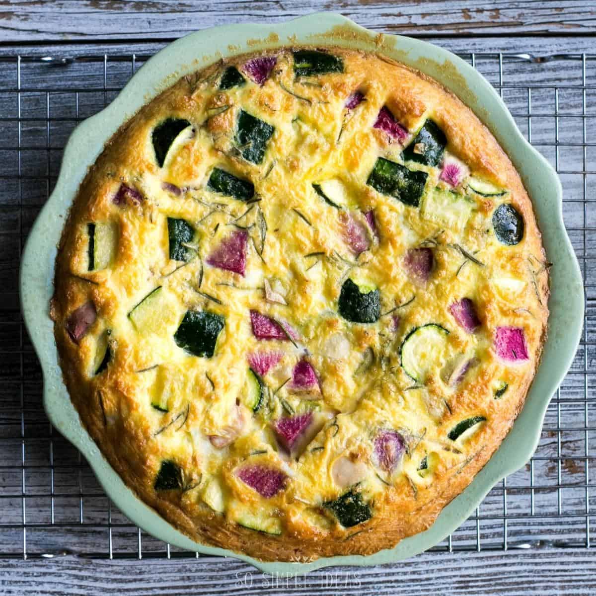 cooling the crustless veggie quiche on rack.