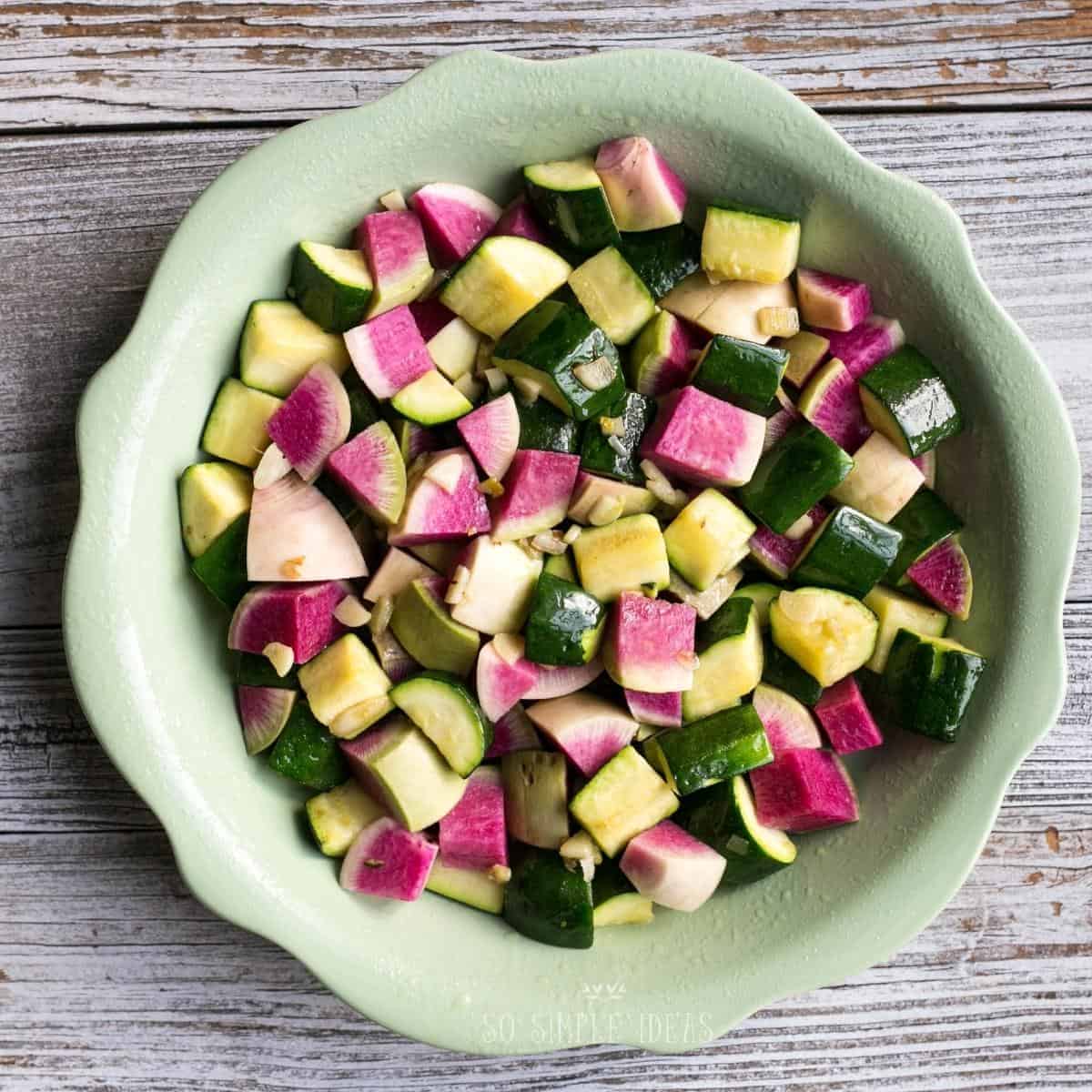 crustless quiche cut veggies in pie dish.