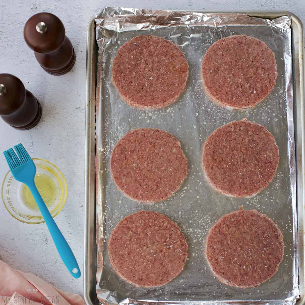 frozen patties on foil lined baking pan.