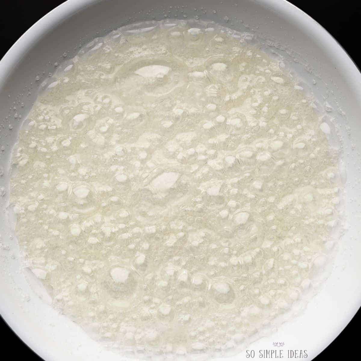 hot sugar syrup boiling in pan.