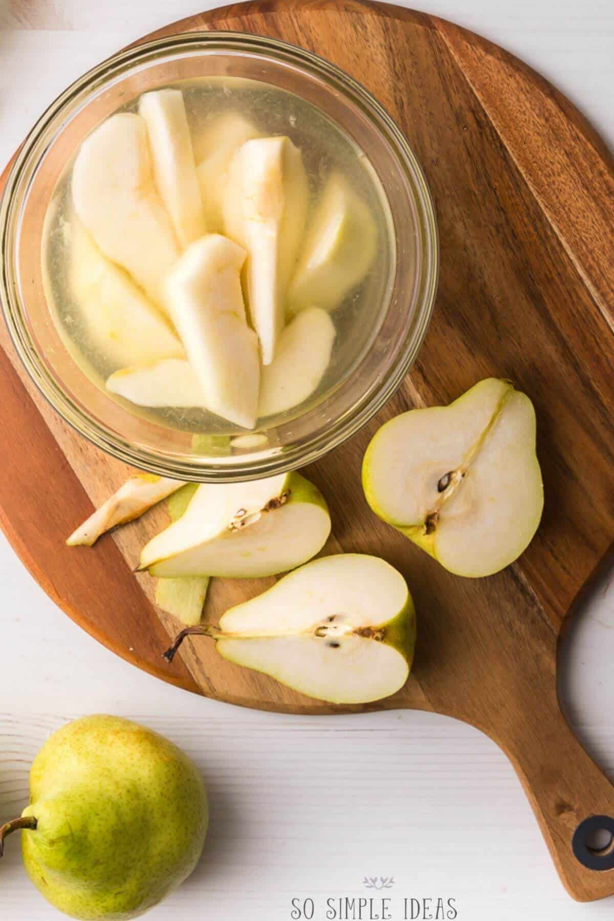 sliced pears on cutting board.