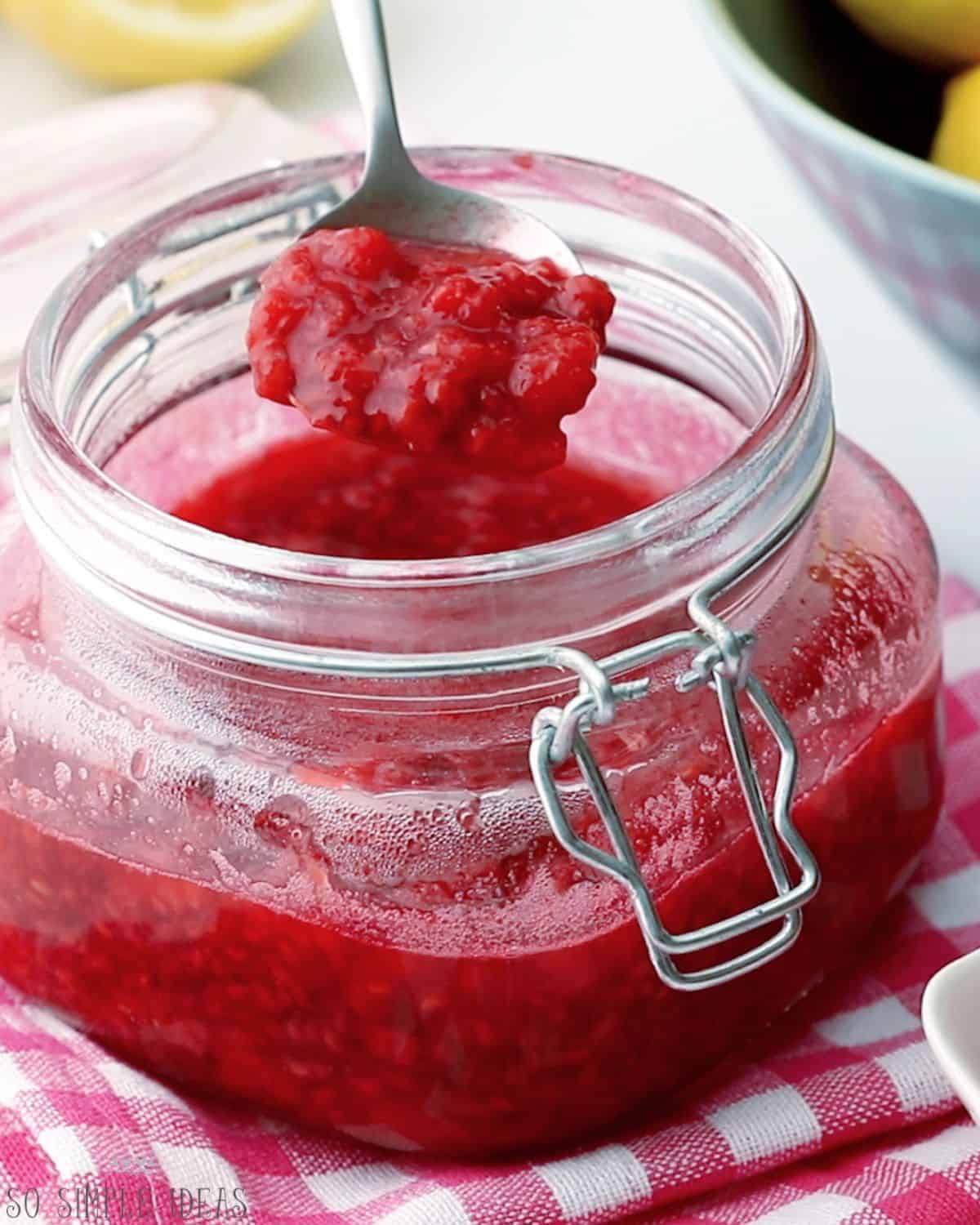 raspberry compote in spoon.