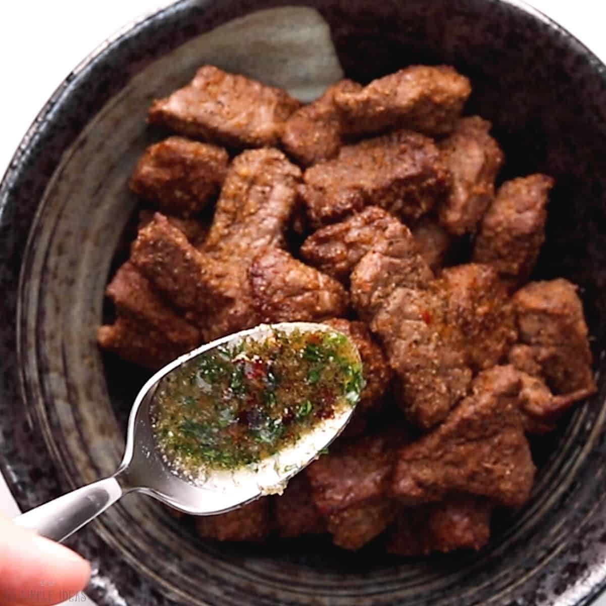 adding seasoned butter onto cooked meat.