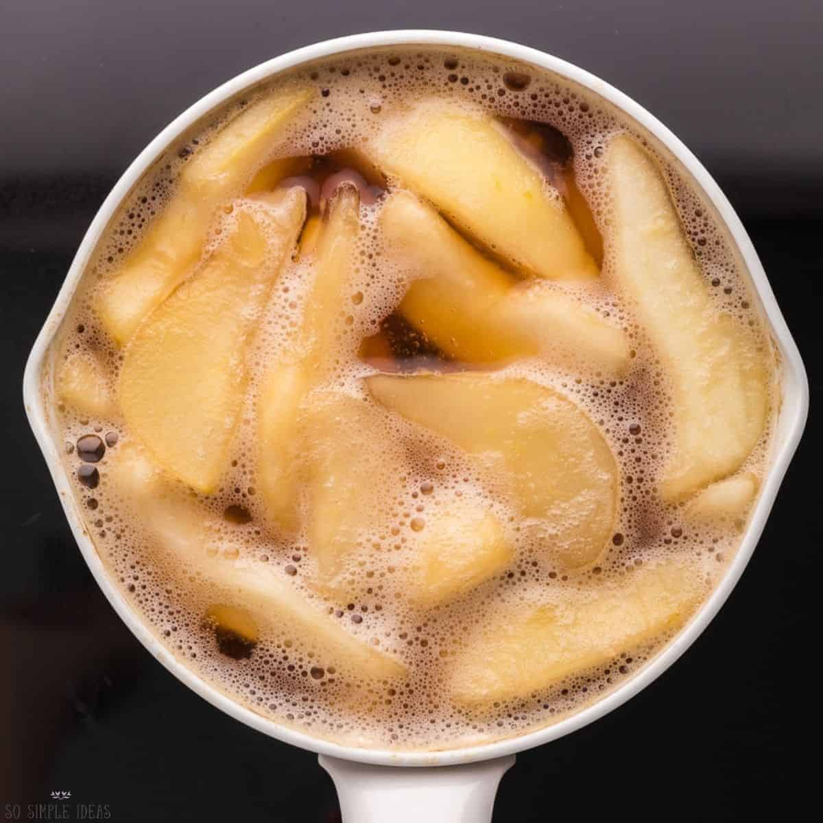 simmered stewed pears in pot.