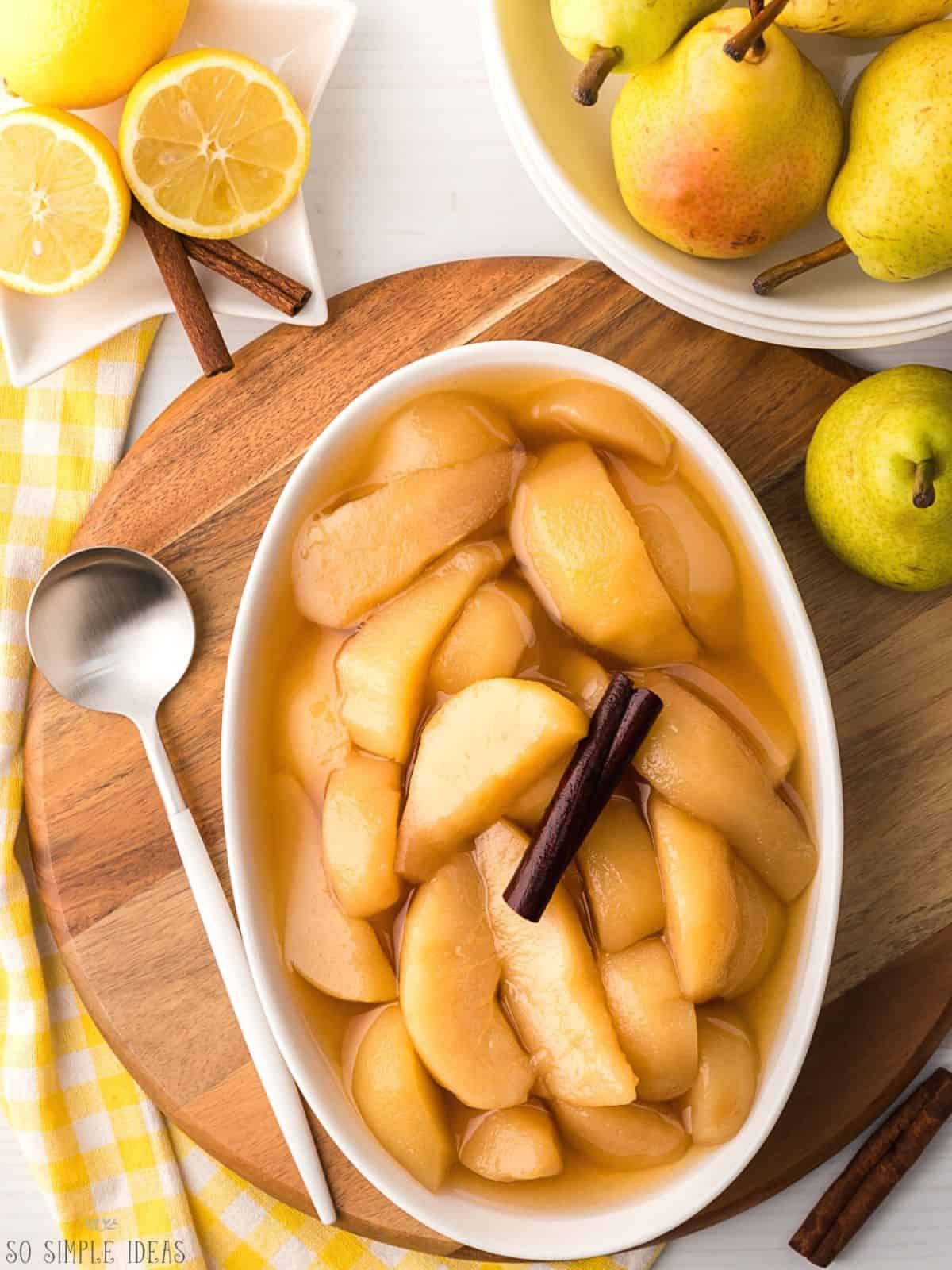 stewed pears in oval dish.