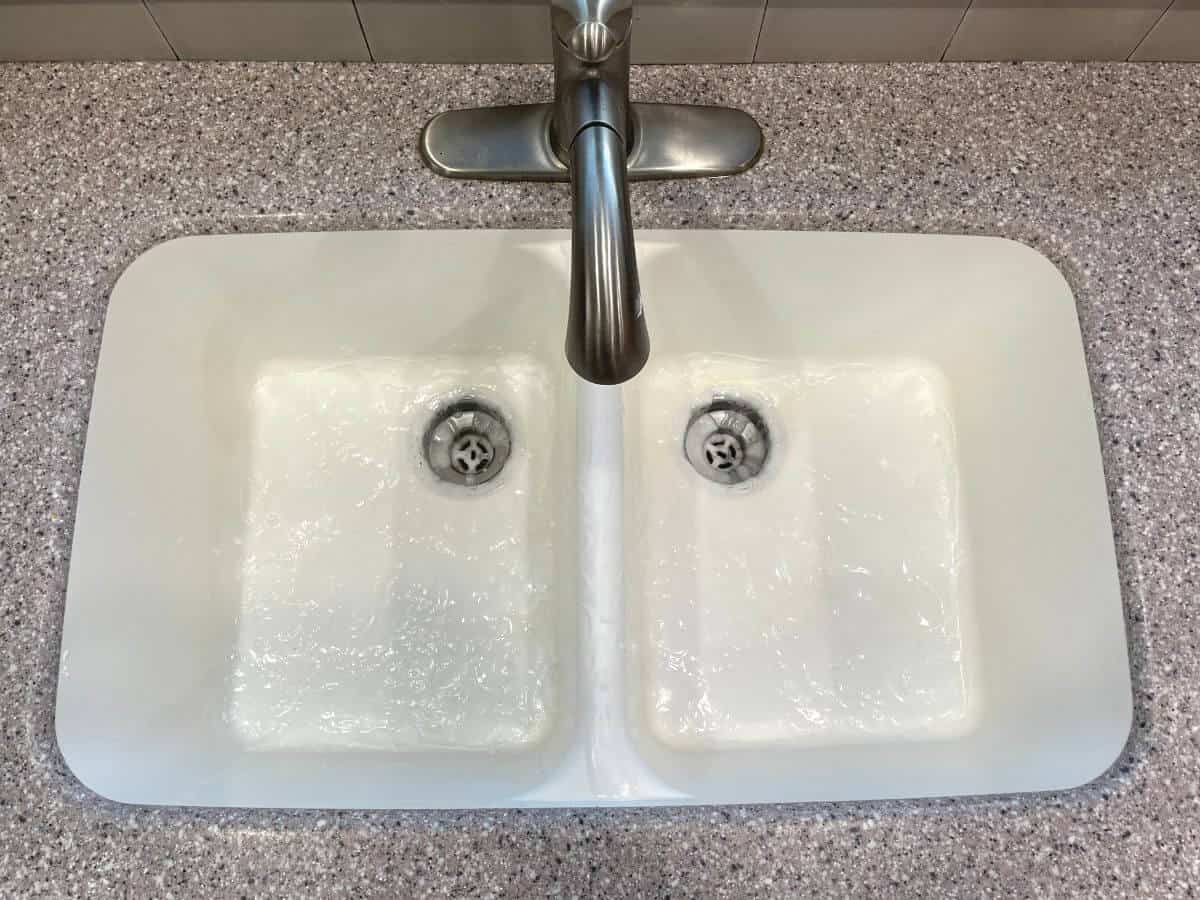 cleaning solution in a corian sink.