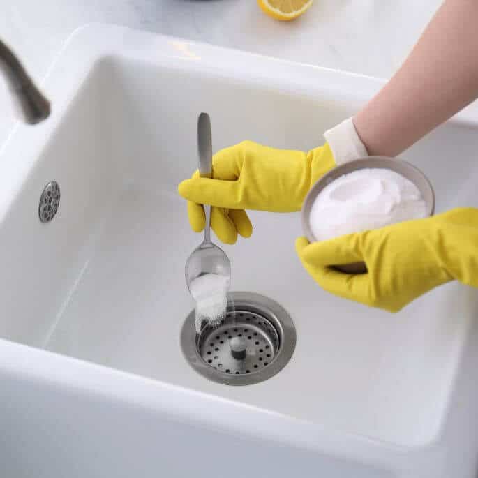 cleaning smelly sink drain with baking soda.