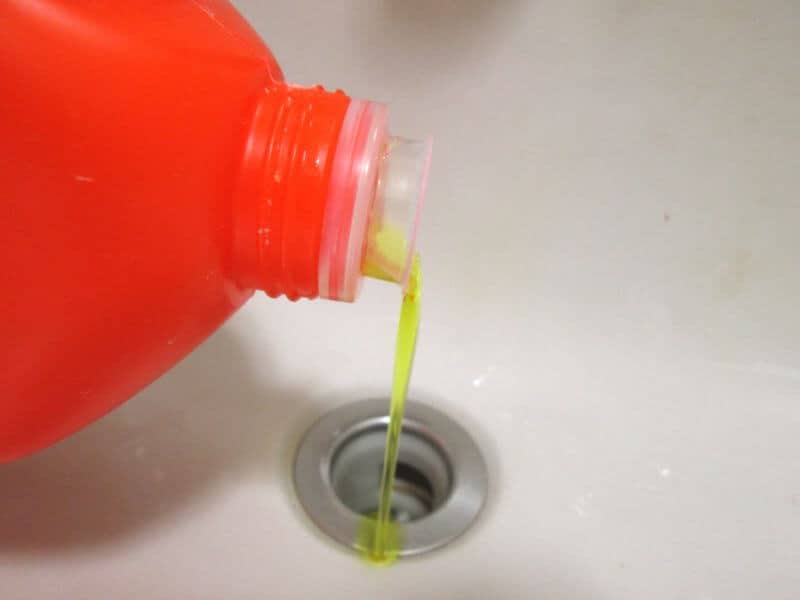 using a commercial drain cleaner.