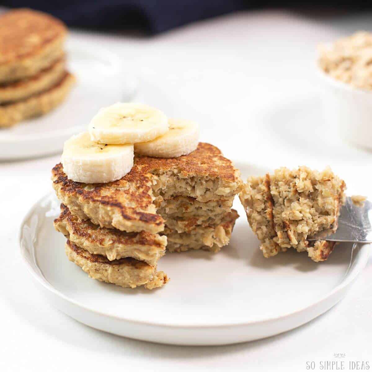 banana oat pancakes with fork bite.