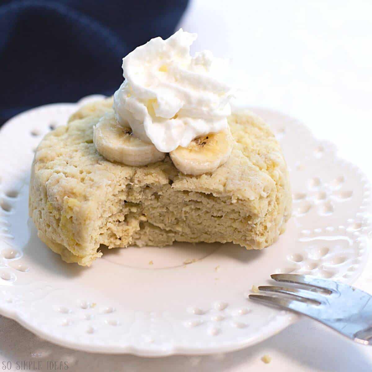 cut banana mug cake on plate.