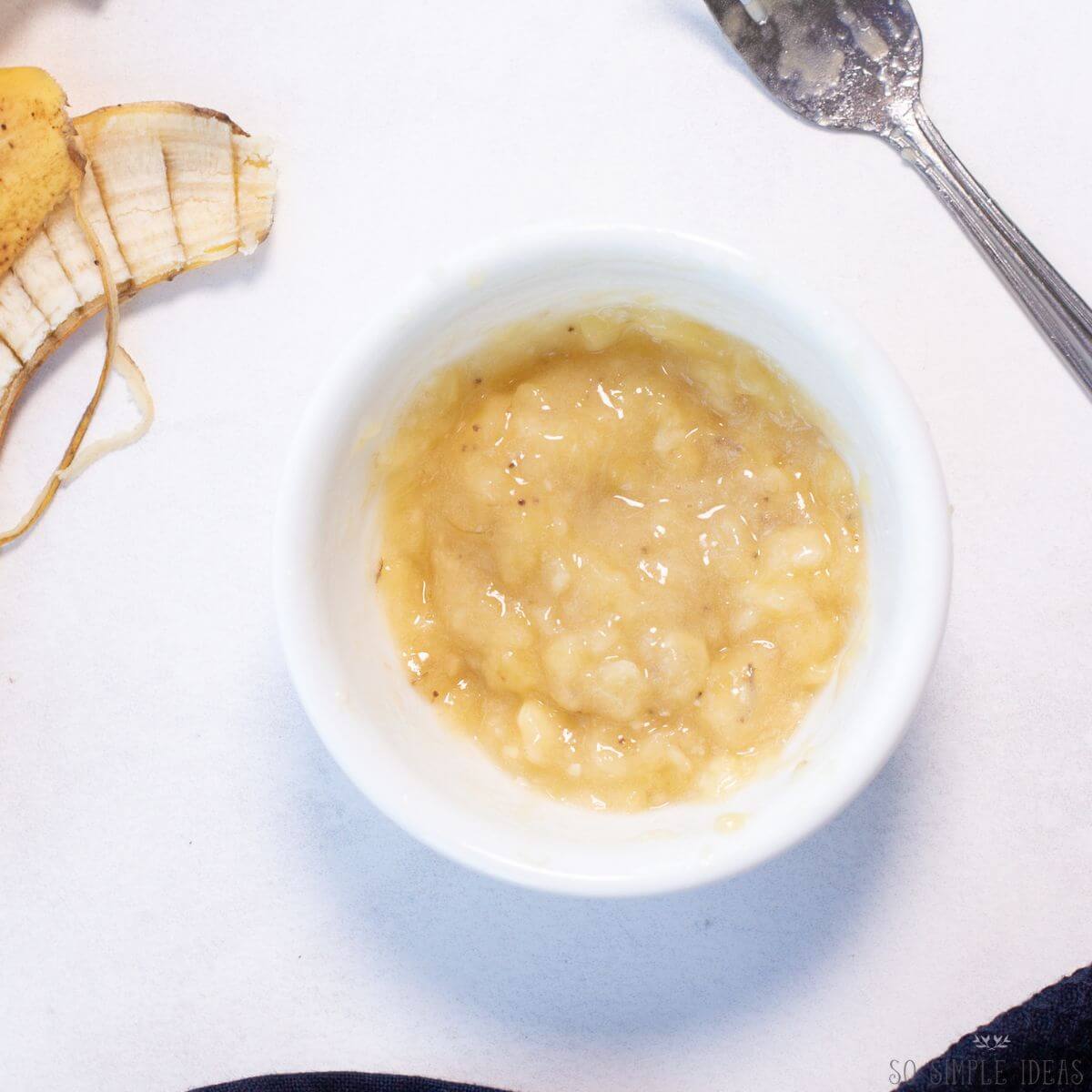 mashed banana in small bowl.