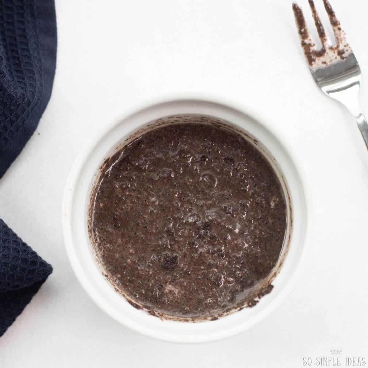 oreo mug cake batter in ramekin.