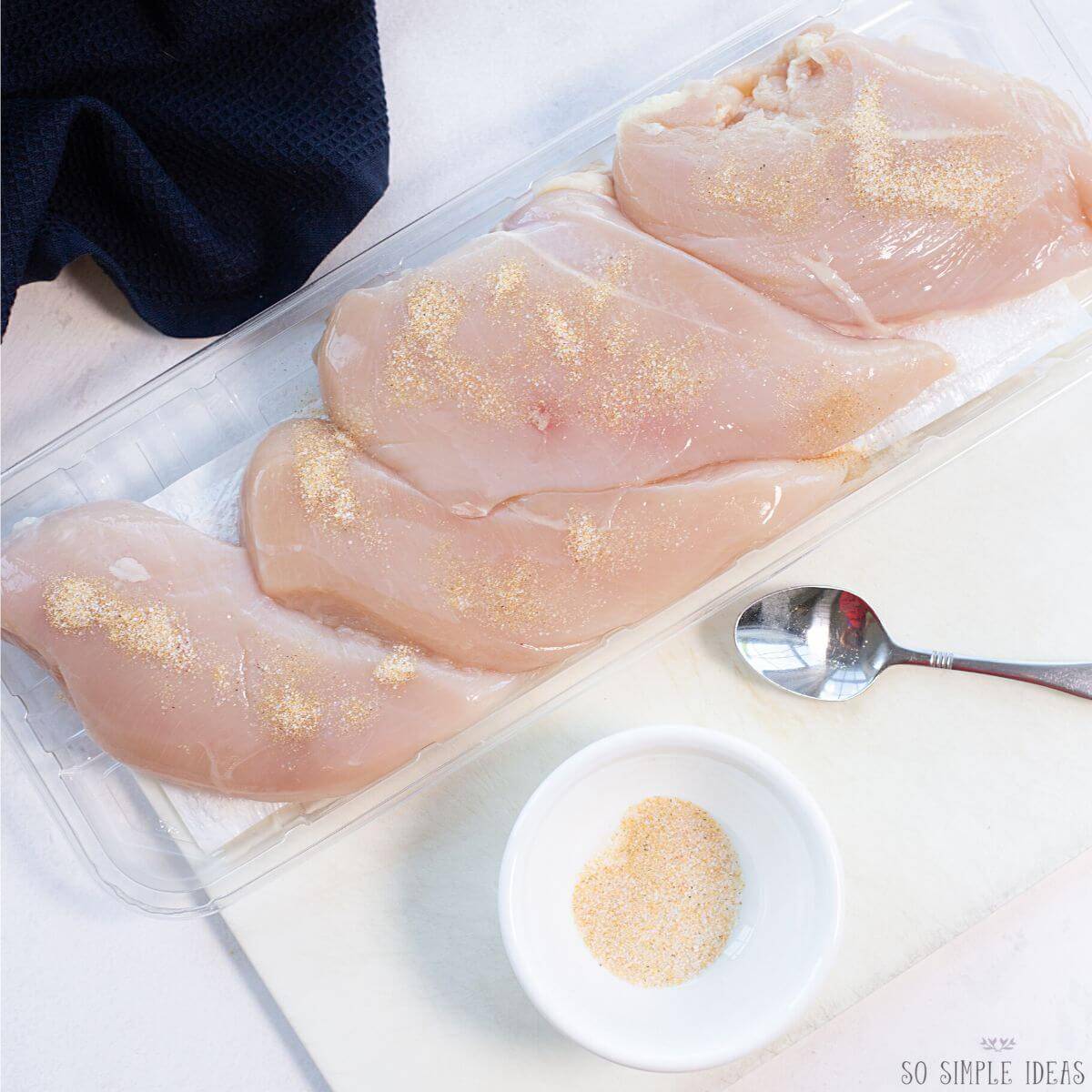 seasoning boneless chicken breasts.